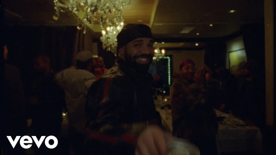 Still from the official Drake Burning Bridges music video in a chandelier-lit party